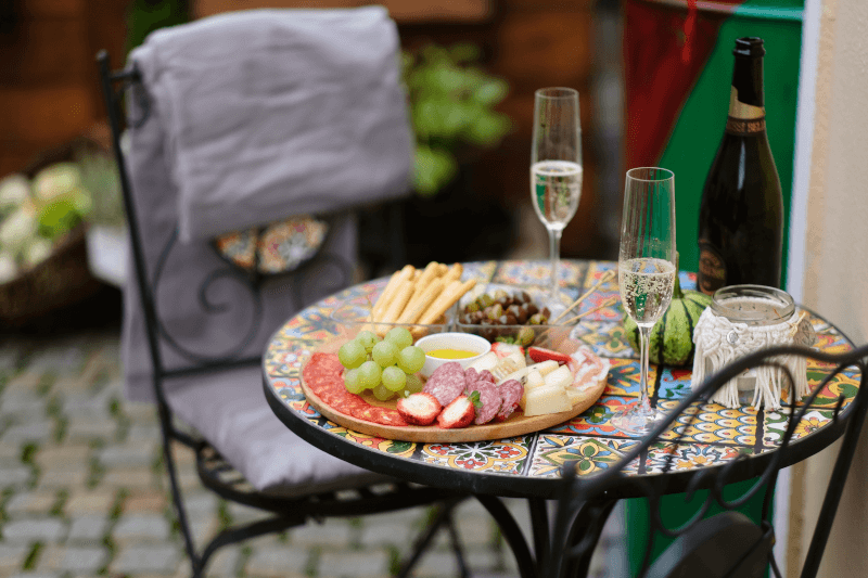 Bistro table with Prosecco and dishes Bistro table with Prosecco and dishes