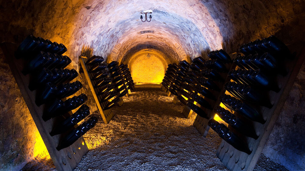 Champagne bottles in the cellar vault Champagne bottles in the cellar vault